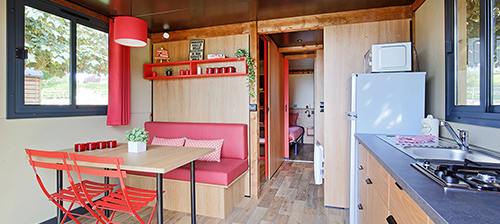 Dining area of the gypsy caravan, an unusual accommodation in Savoy